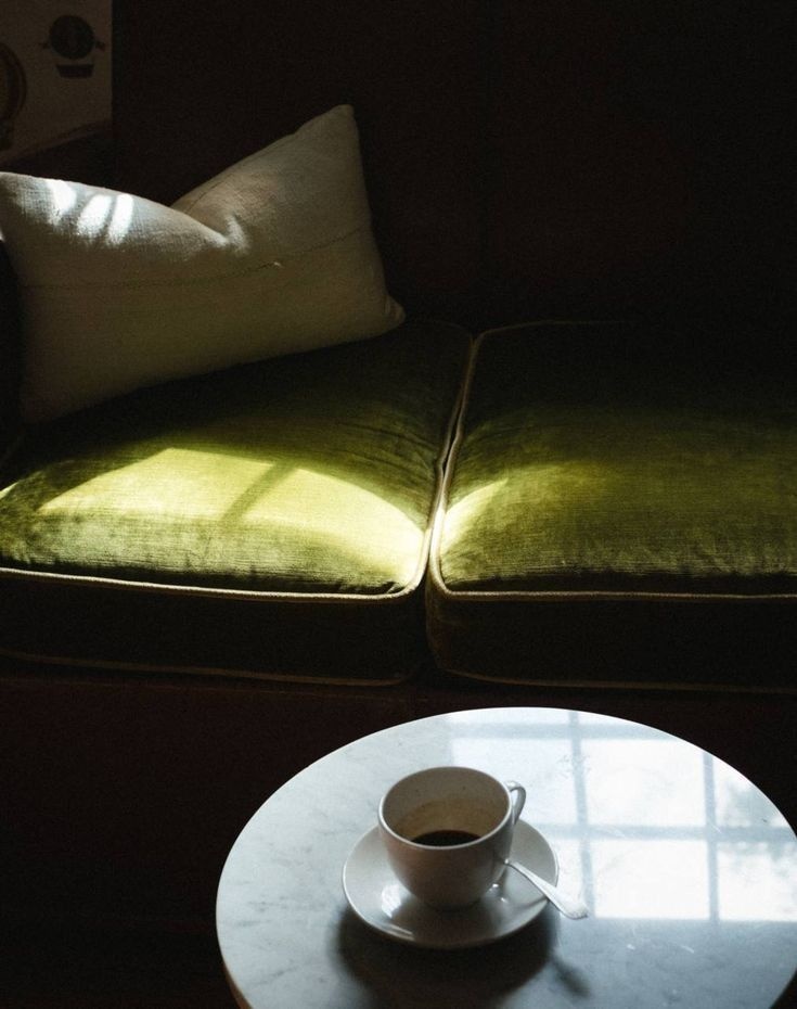 Green velvet chair in quiet light